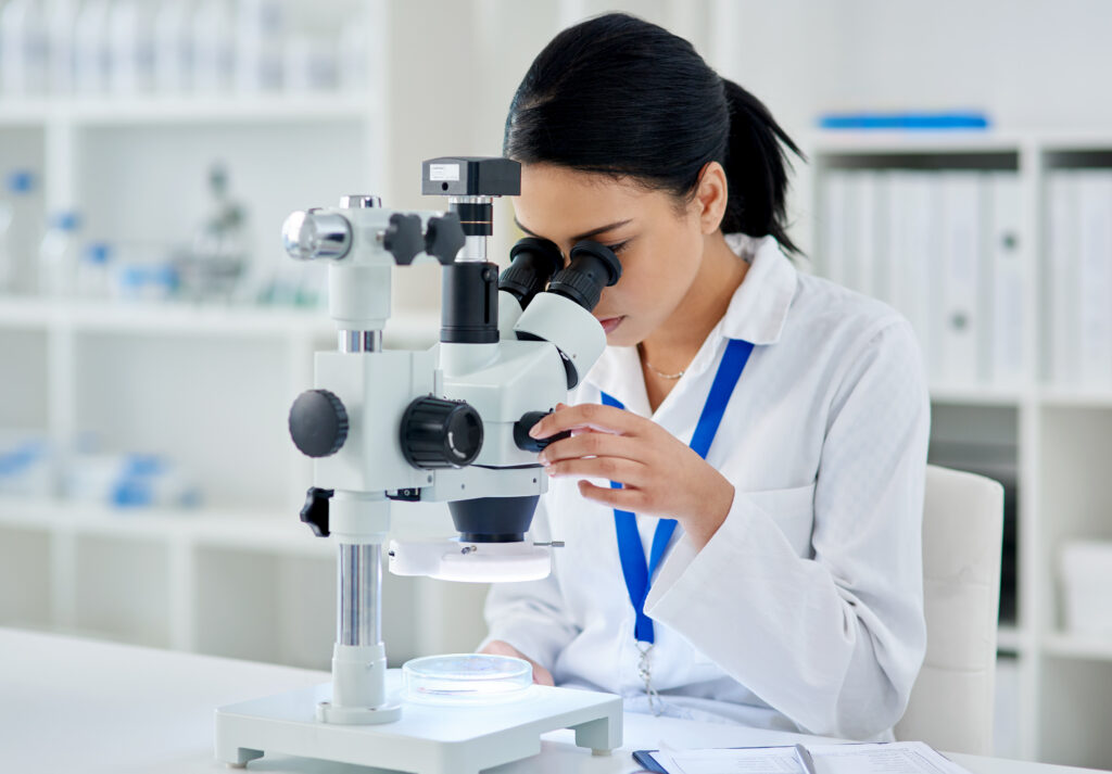 Medical research done right. Shot of a young scientist using a microscope in a laboratory.